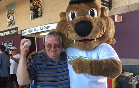 Dr Coyne with Mascot