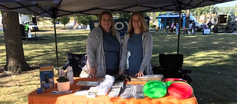 two veterinary employees at an event